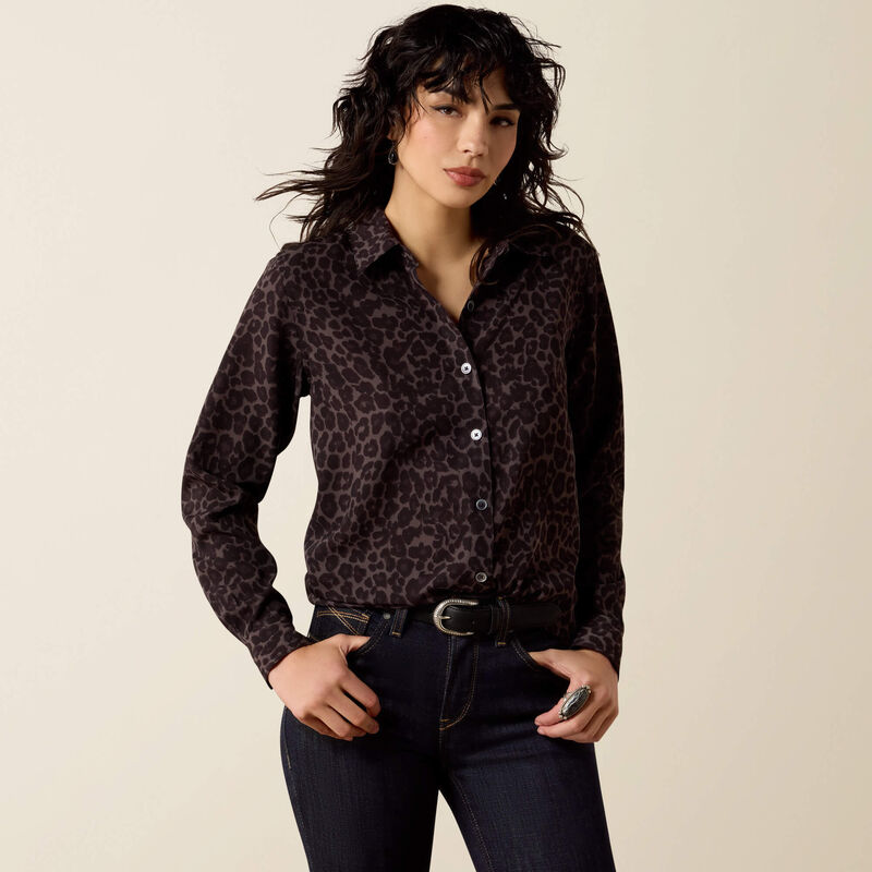 woman wearing Ariat leopard button up blouse