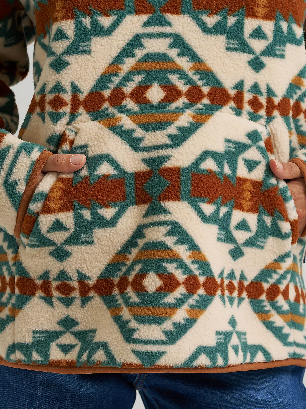 Close-up of the Wrangler Sherpa Pullover's front pocket and southwest print