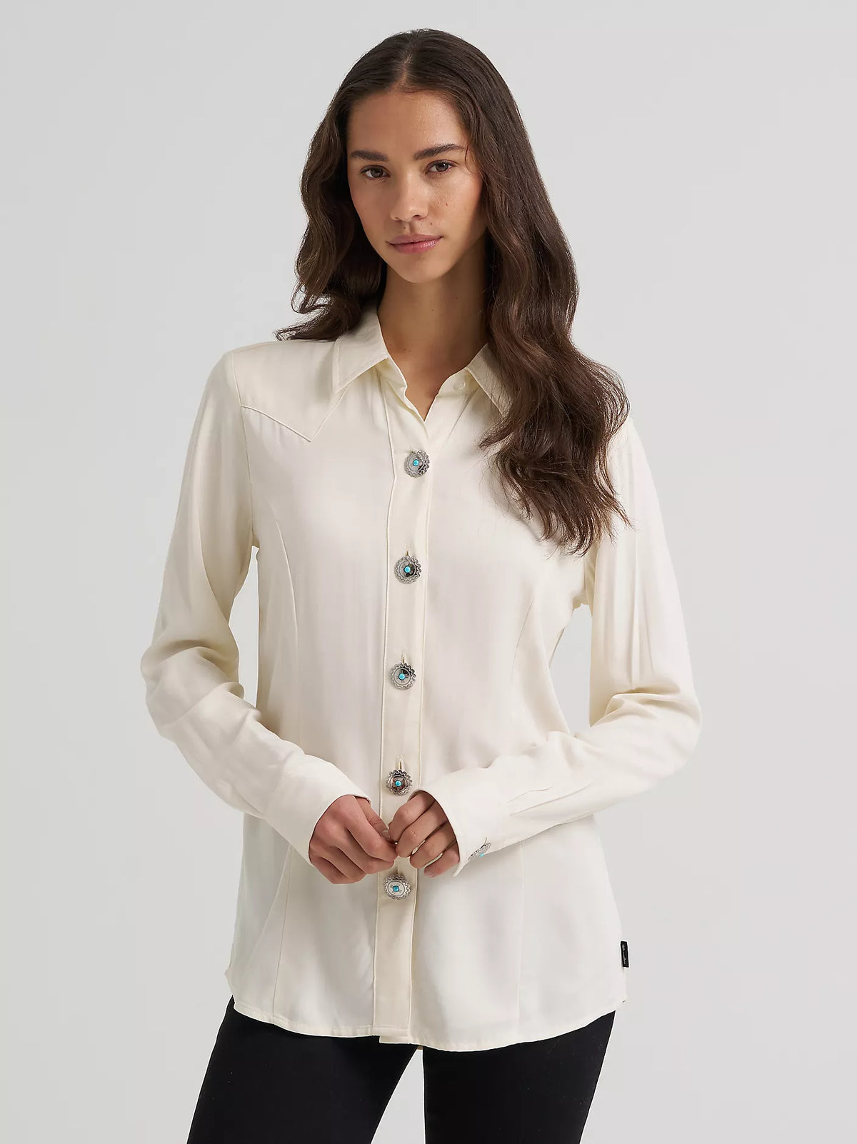 Wrangler women's Western long sleeve concho shirt in white, front view on a model