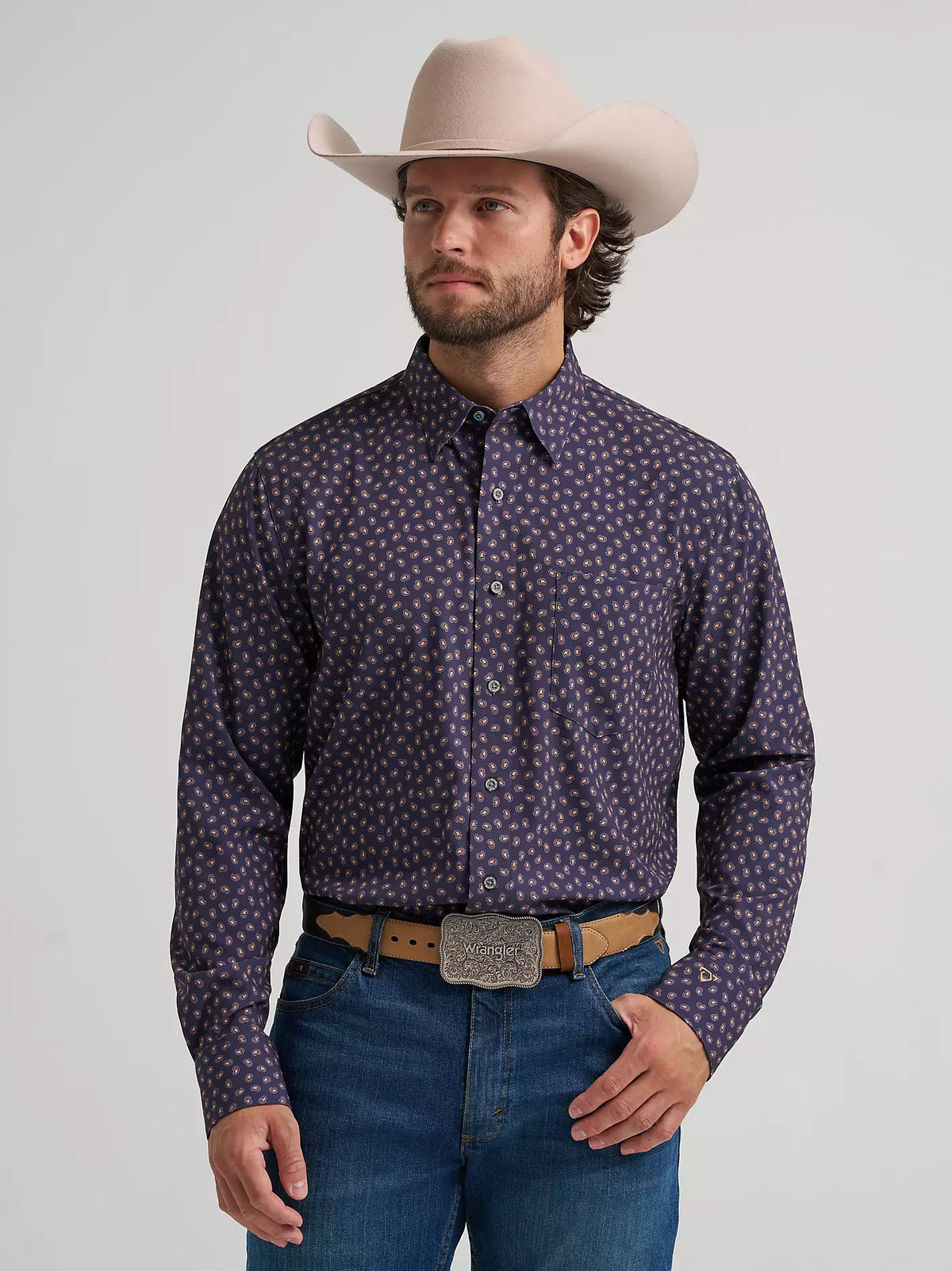 Wrangler men's Western long sleeve print button shirt in navy, front view on a model