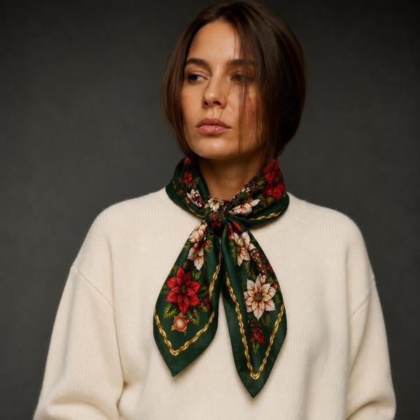 Holiday Square Scarf in Dark Green with red floral print, tied at the neck on a model