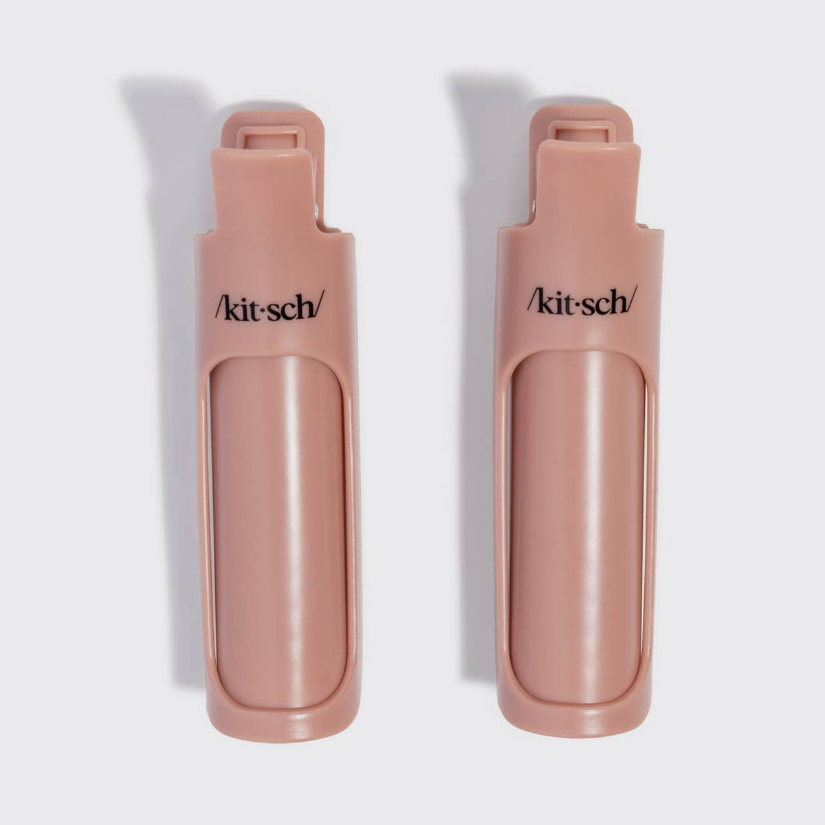 Two terracotta Kitsch Hair Volumizing Clips, closed, front view