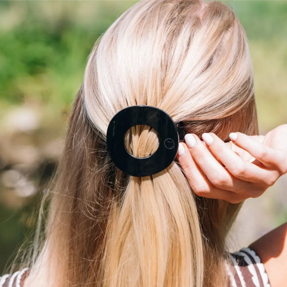 Teleties Jet Black Medium Flat Circle Hair Clip worn in blonde half-up hair