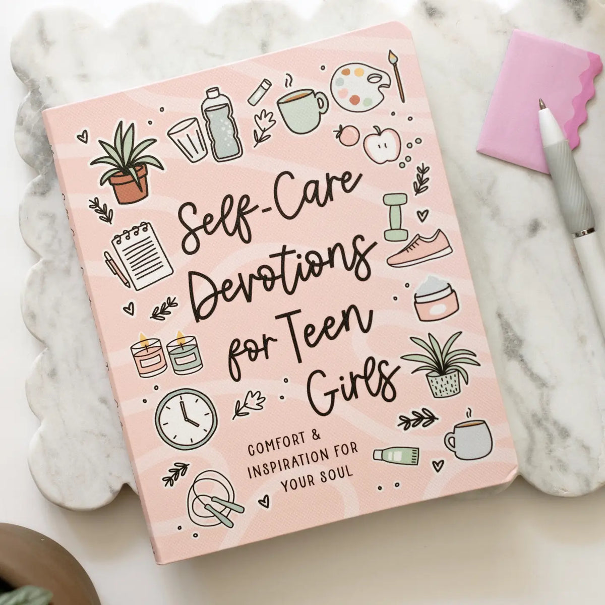 Self-Care Devotions for Teen Girls, pink front cover on marble