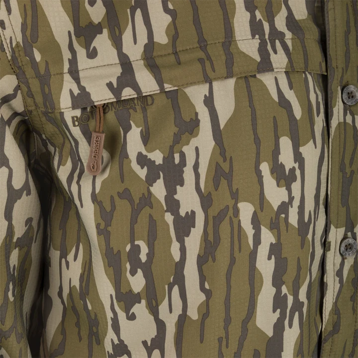 Drake 8 Shot Flyweight Bottomland camo shirt, close-up of zip chest pocket