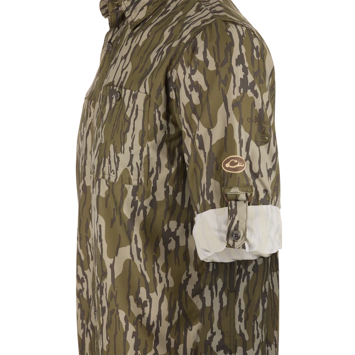 Drake 8 Shot Flyweight Bottomland camo shirt, side view with sleeve roll-up tab