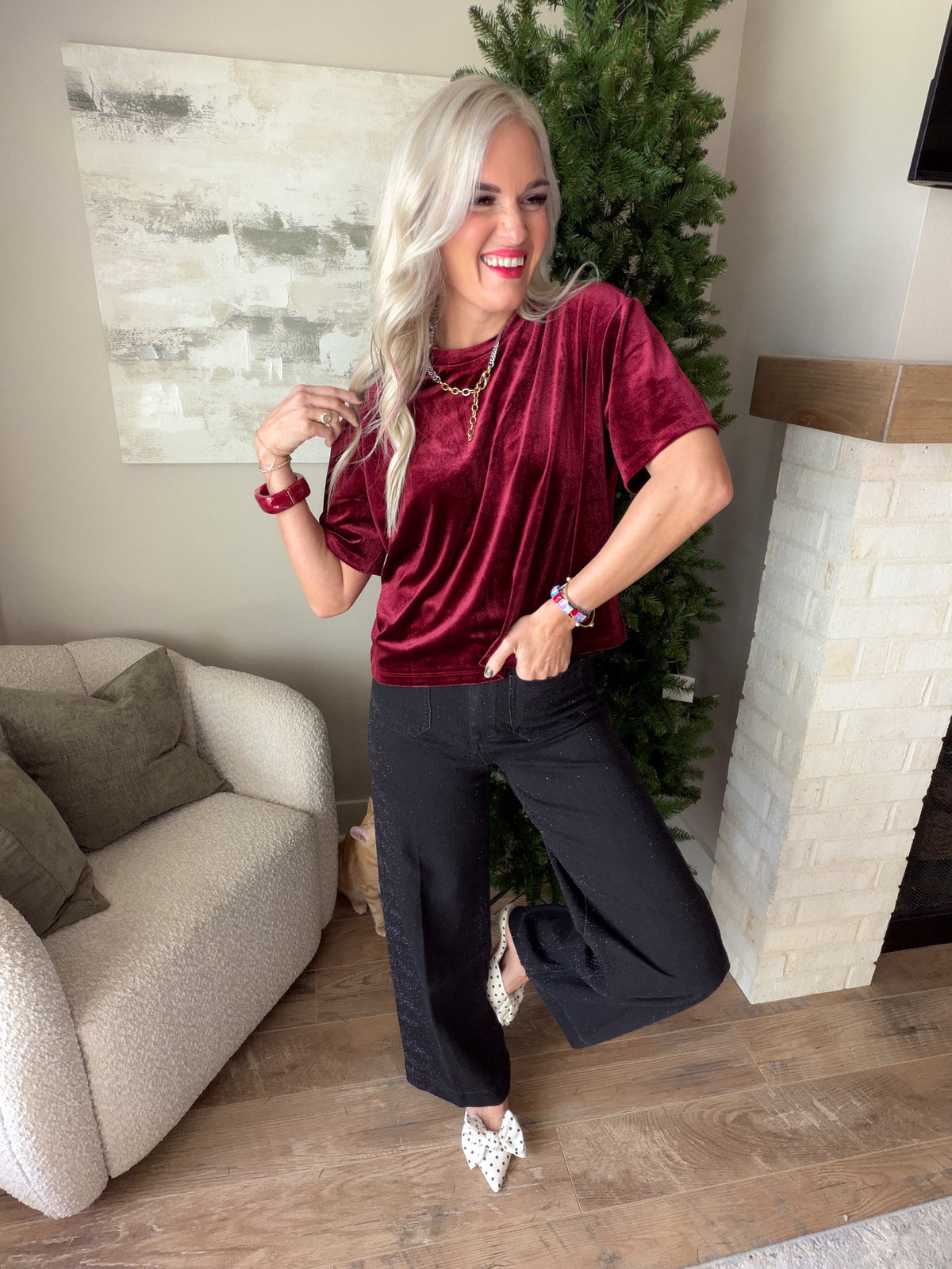 Dear John Maddox Toasted Currant velvet tee styled with black wide-leg trousers and pointed-toe flats.