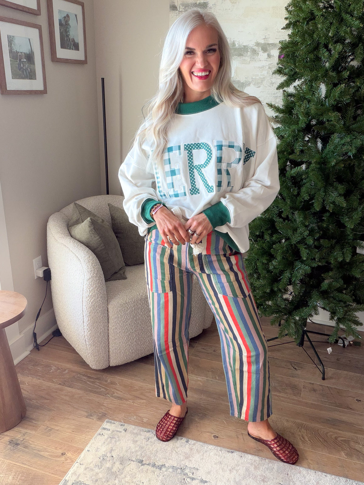 What's Your Narrative multi stripe jeans styled with a cream and green sweatshirt and burgundy woven mules.