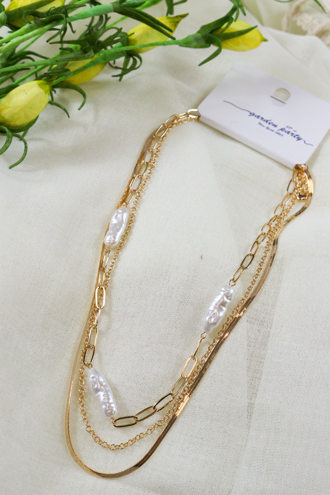 Gold Multi Chain with Oval Pearl Necklace