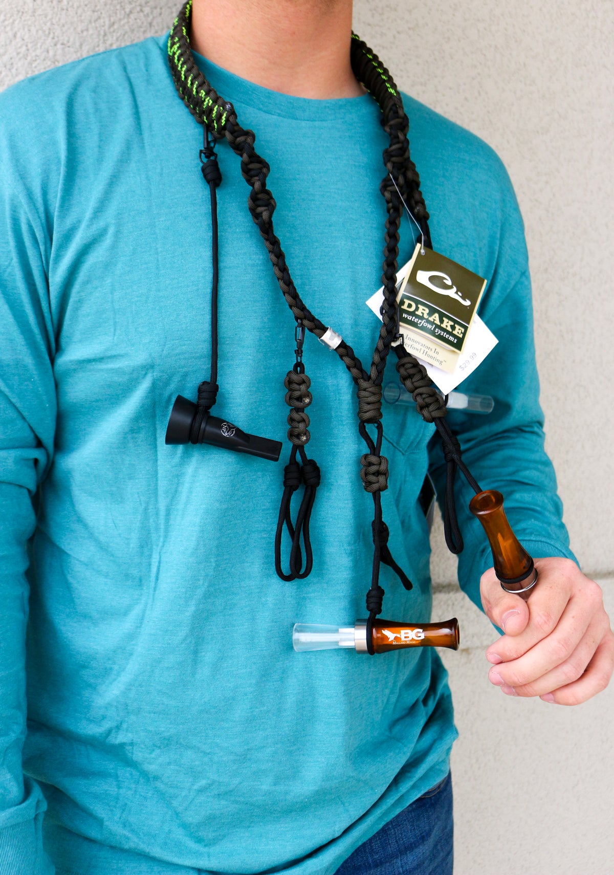 Drake Paracord Duck Caller's Lanyard worn with calls attached, front torso view