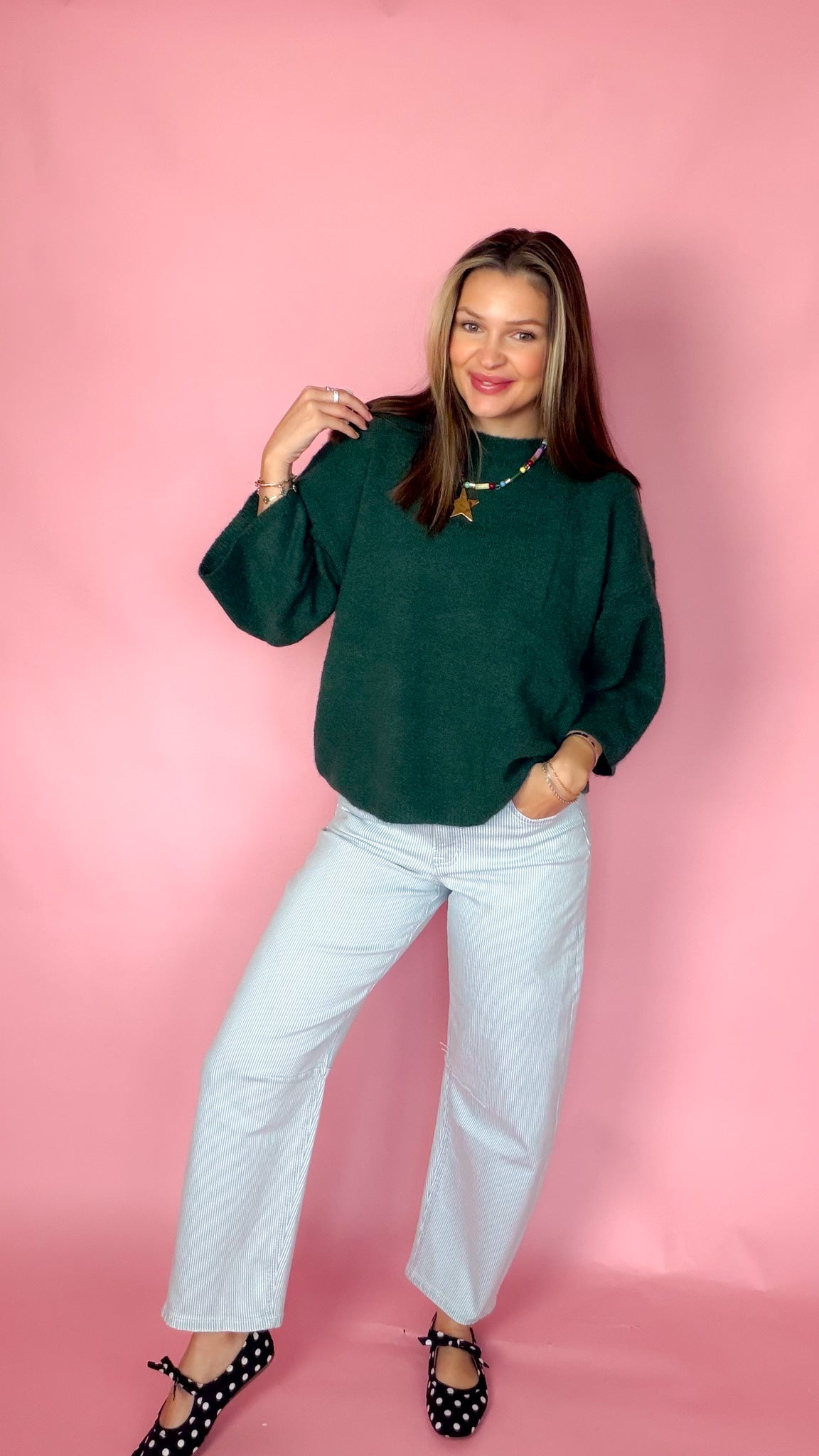 Sweet Nothings Hunter Green Sweater with light wide-leg jeans, front view
