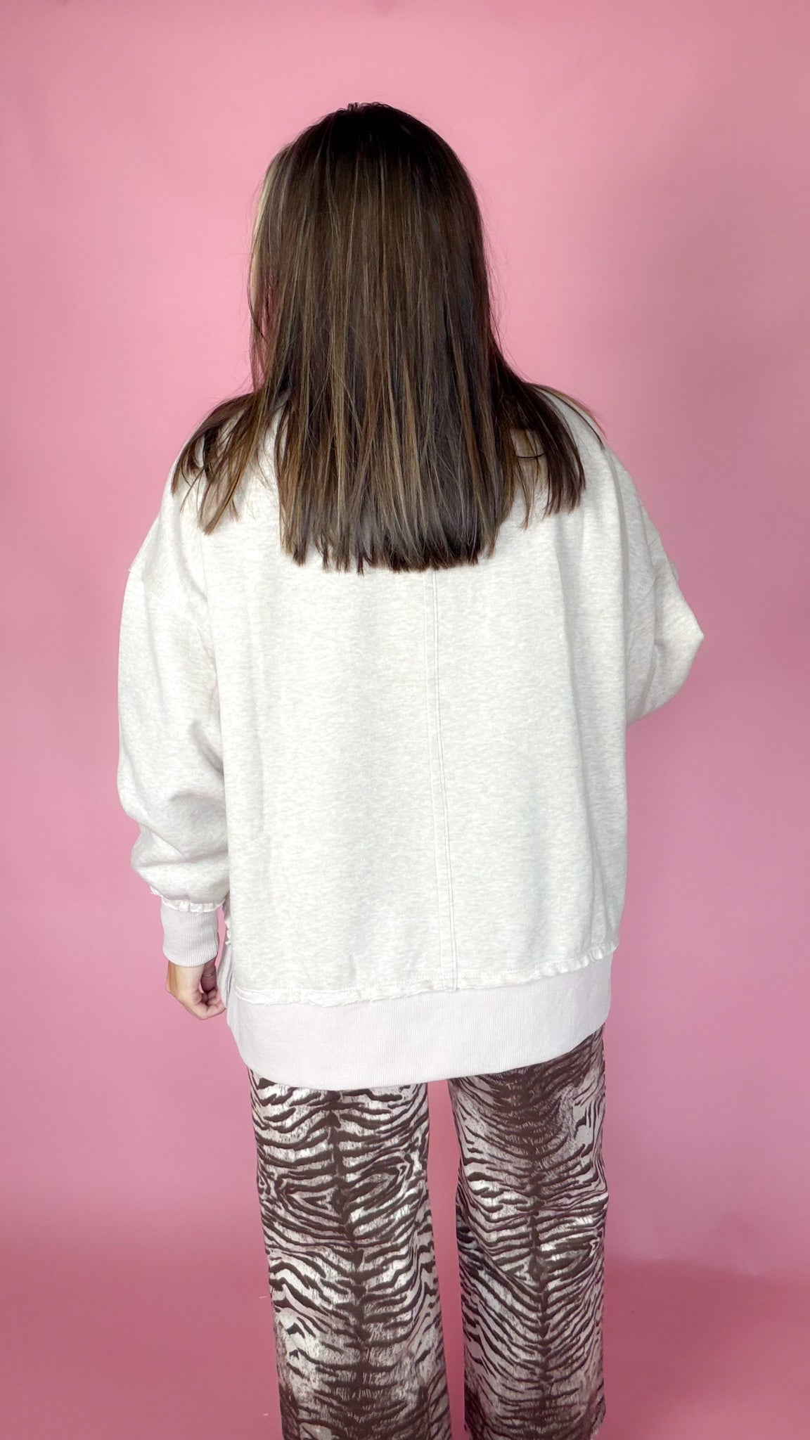 Back view of the Keeping Score oatmeal 83 sweatshirt