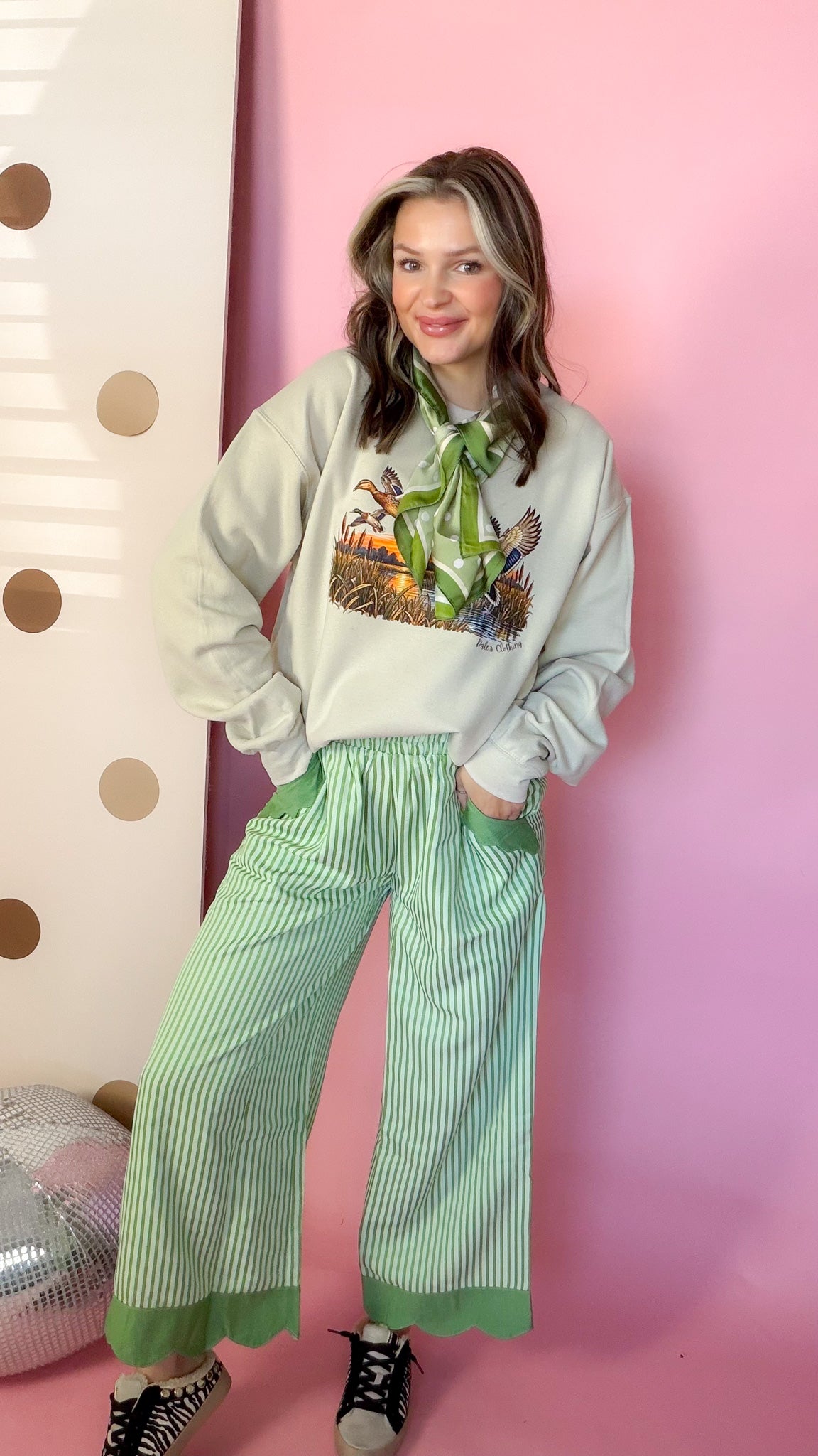 Umgee Reason To Celebrate sage green stripe pants, front with sweatshirt