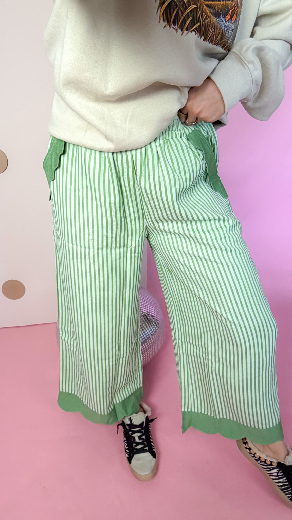 Reason To Celebrate sage stripe pants, close-up of wide leg and hem