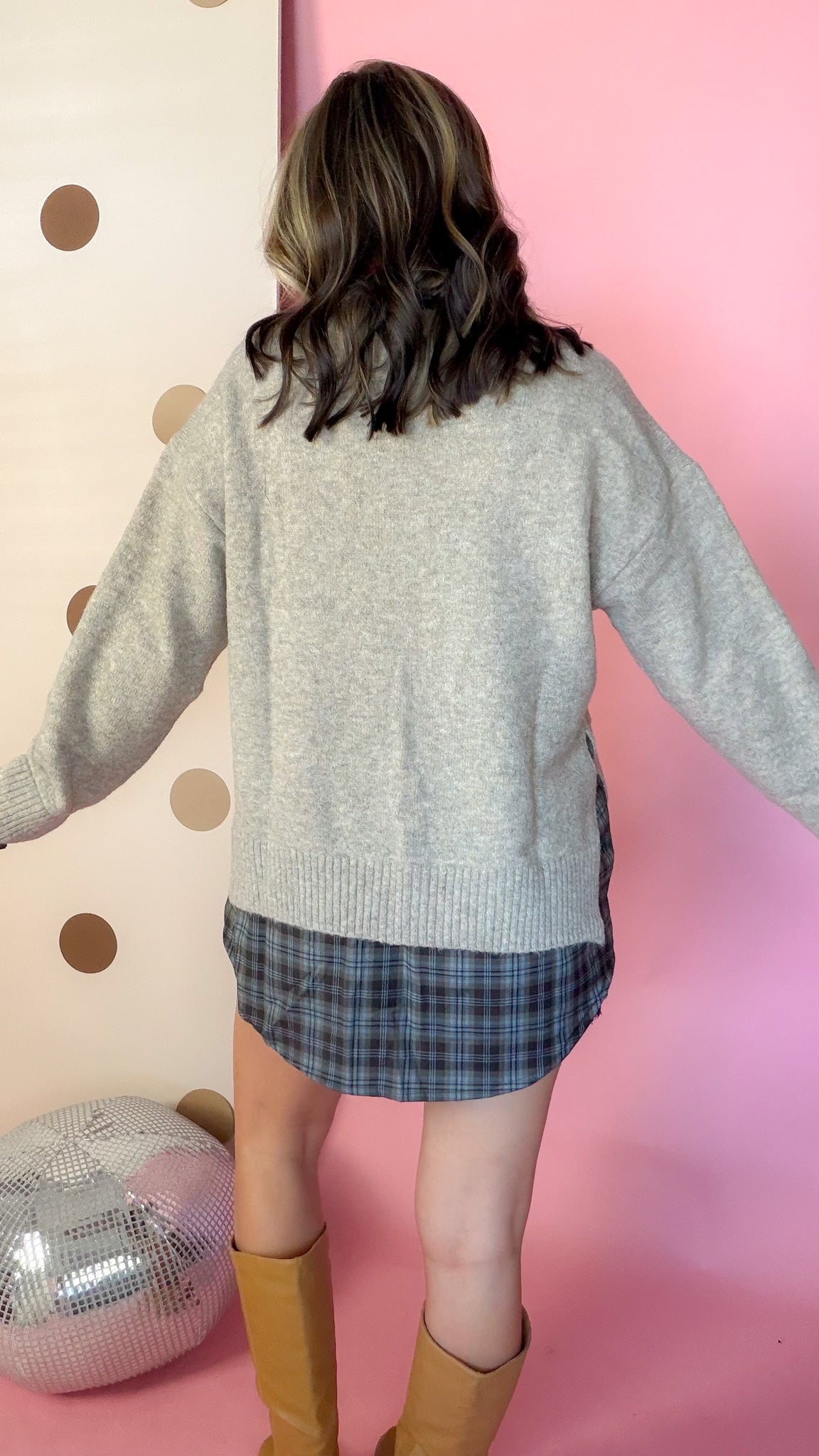 A Warming Welcome sweater, back view on model
