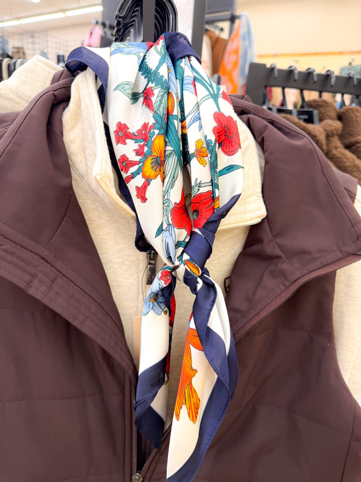 Large floral print bandana scarf, close-up of red poppy print over vest