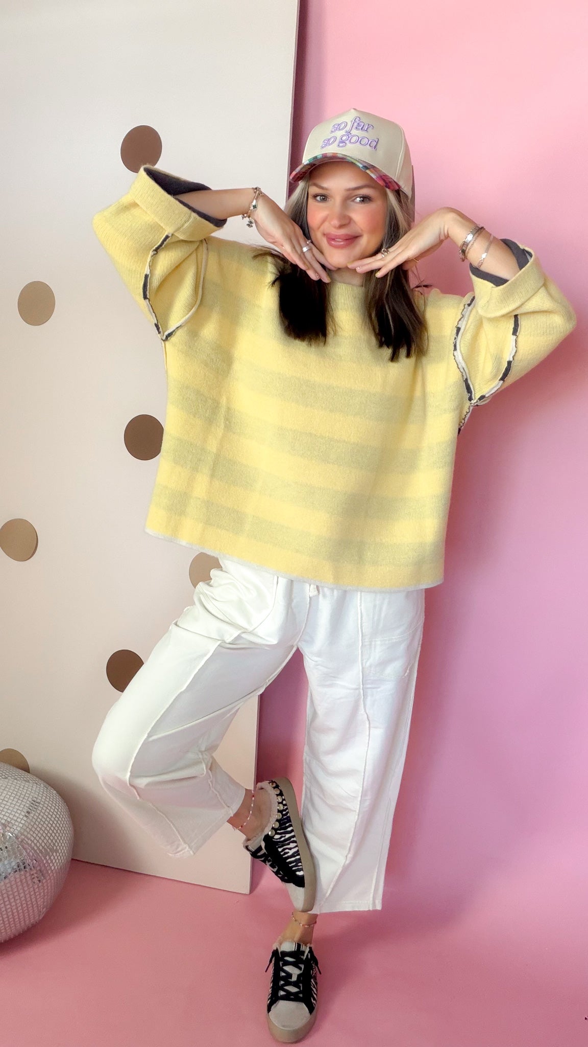 Model wearing Ecru terry knit barrel pants with a yellow top, showing the relaxed fit with one leg bent.