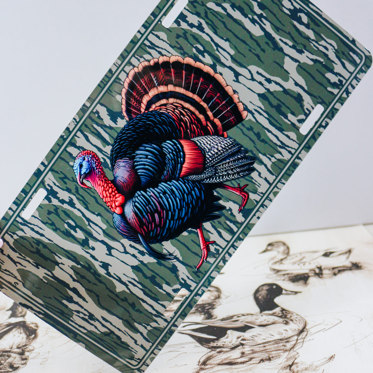 Decorative license plates in camo turkey, farm, and patriotic novelty designs