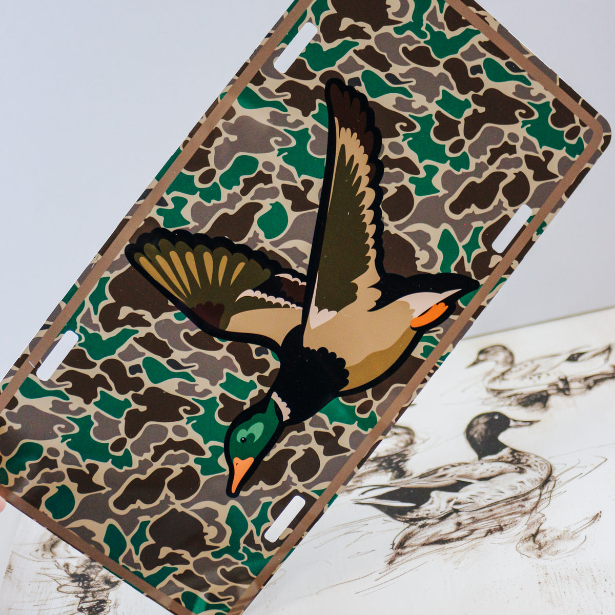 Decorative license plates in camo turkey, farm, and patriotic novelty designs
