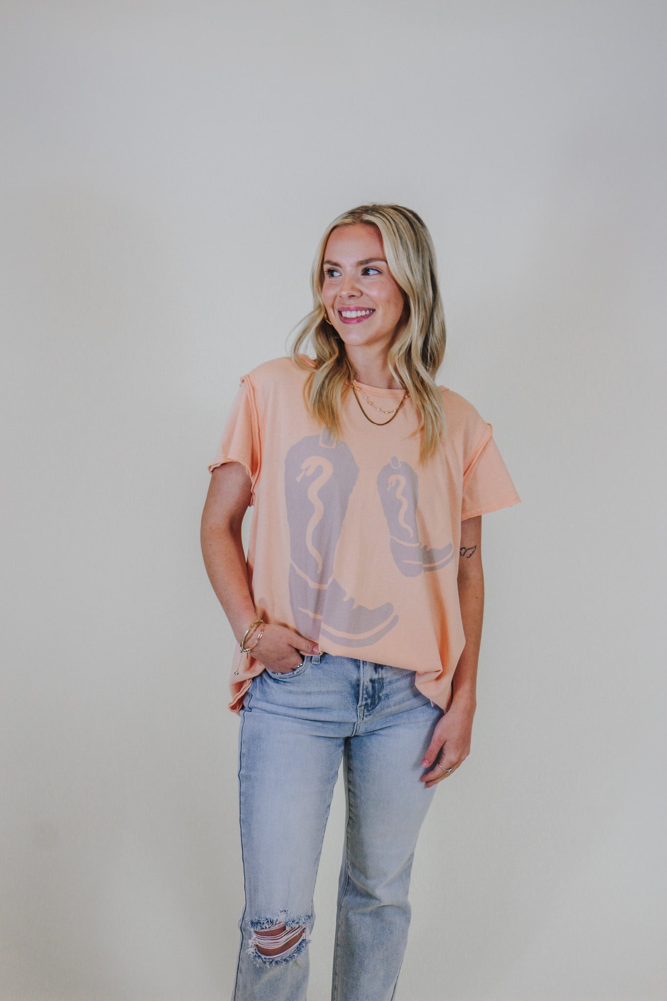 Boot Wearing Girl Cantaloupe Orange Graphic Tee