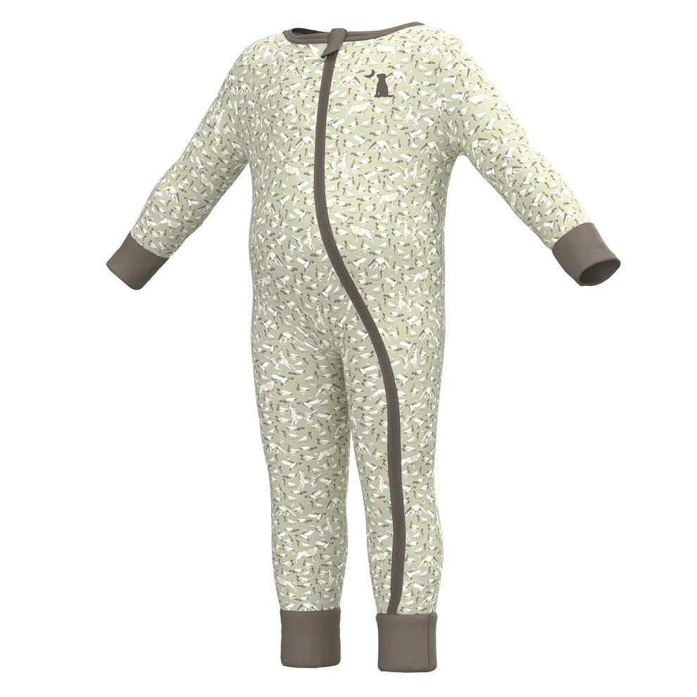 A baby long-sleeve footless one-piece pajama with an all-over abstract pattern in light sage green and white, featuring solid taupe-brown cuffs, a side zipper, and a small embroidered logo on the chest.