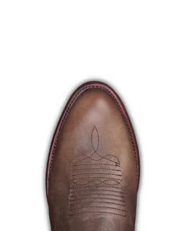 Brown leather boot with intricate stitching on a black background. Tecovas dress boots for men