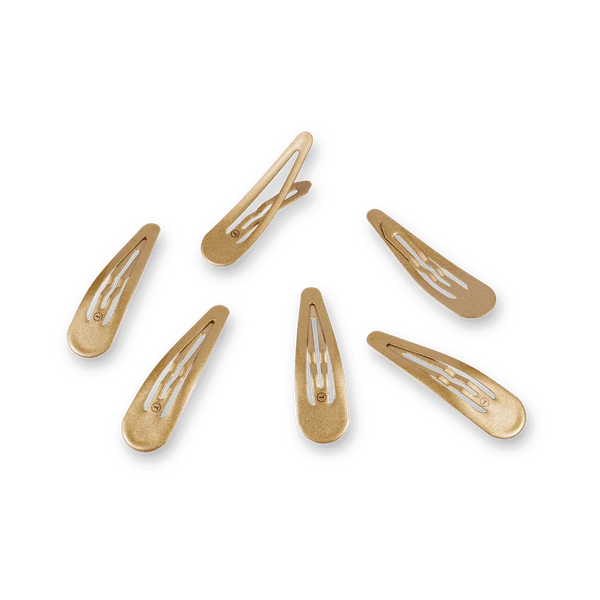 Teleties gold snap clips 6 pack, scattered on black background