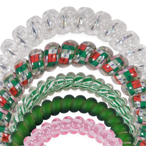 Close-up of Teleties No Peeking Allowed spiral hair ties in clear, red, green and pink
