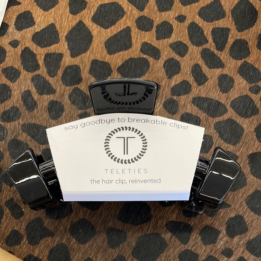 TELETIES Black Nonbreakable Claw Clip with logo card on a leopard print background