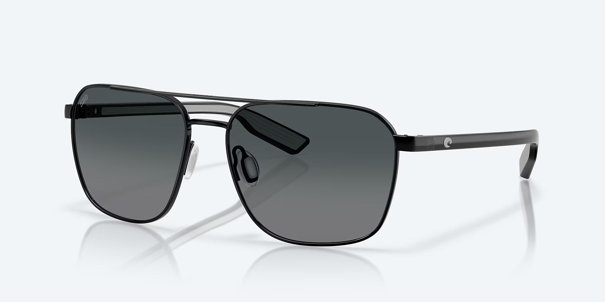 Costa Wader polarized sunglasses with black metal frame and gray lenses, angled view