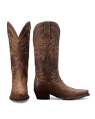 Pair of brown cowboy boots with intricate designs. Tecovas women’s cowboy boots