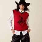 Ariat Taylor sweater vest in Savvy Red with bronc rider design, front view on a model