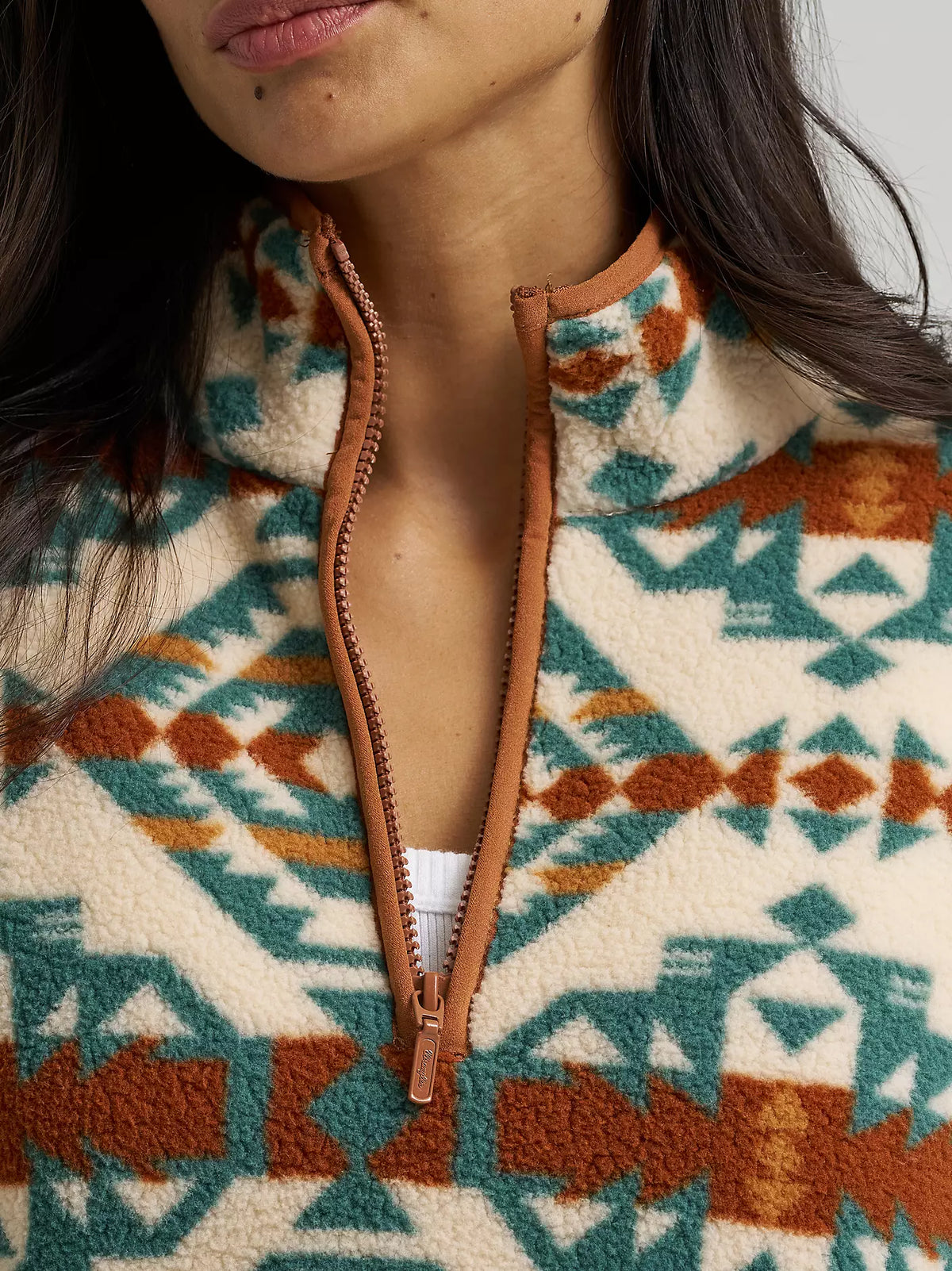 Close-up of the Wrangler Sherpa Pullover's rust-trimmed half zip collar