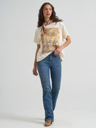 Wrangler Retro Western Graphic Tee, full-length outfit with bootcut jeans and neck scarf