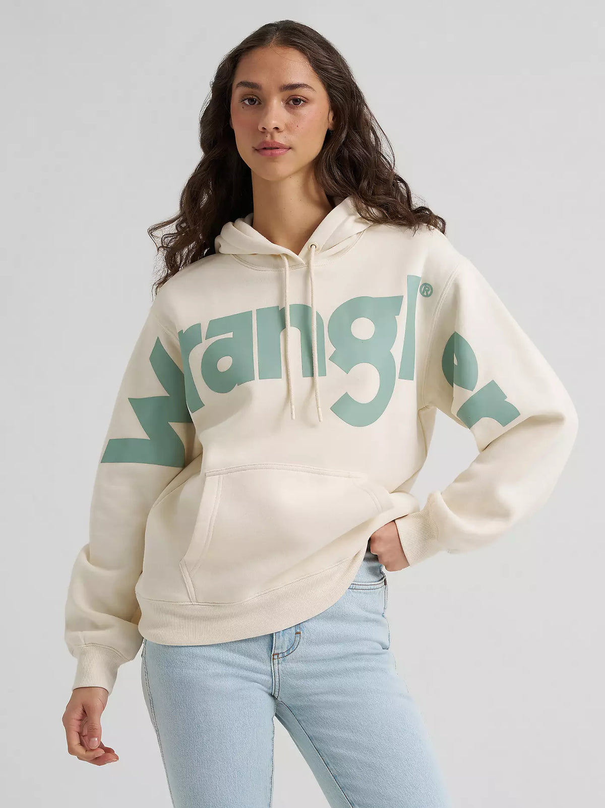Wrangler Western Logo Hoodie in cream with large green Wrangler logo, front view on a model