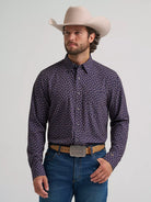 Wrangler men's Western long sleeve print button shirt in navy, front view on a model