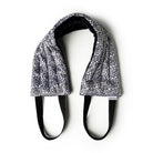 Hot Stuff Heated Neck Wrap in black and white leaf print, out of the box with black straps