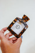 TELETIES Medium Tortoise Square Clip held in hand, front view