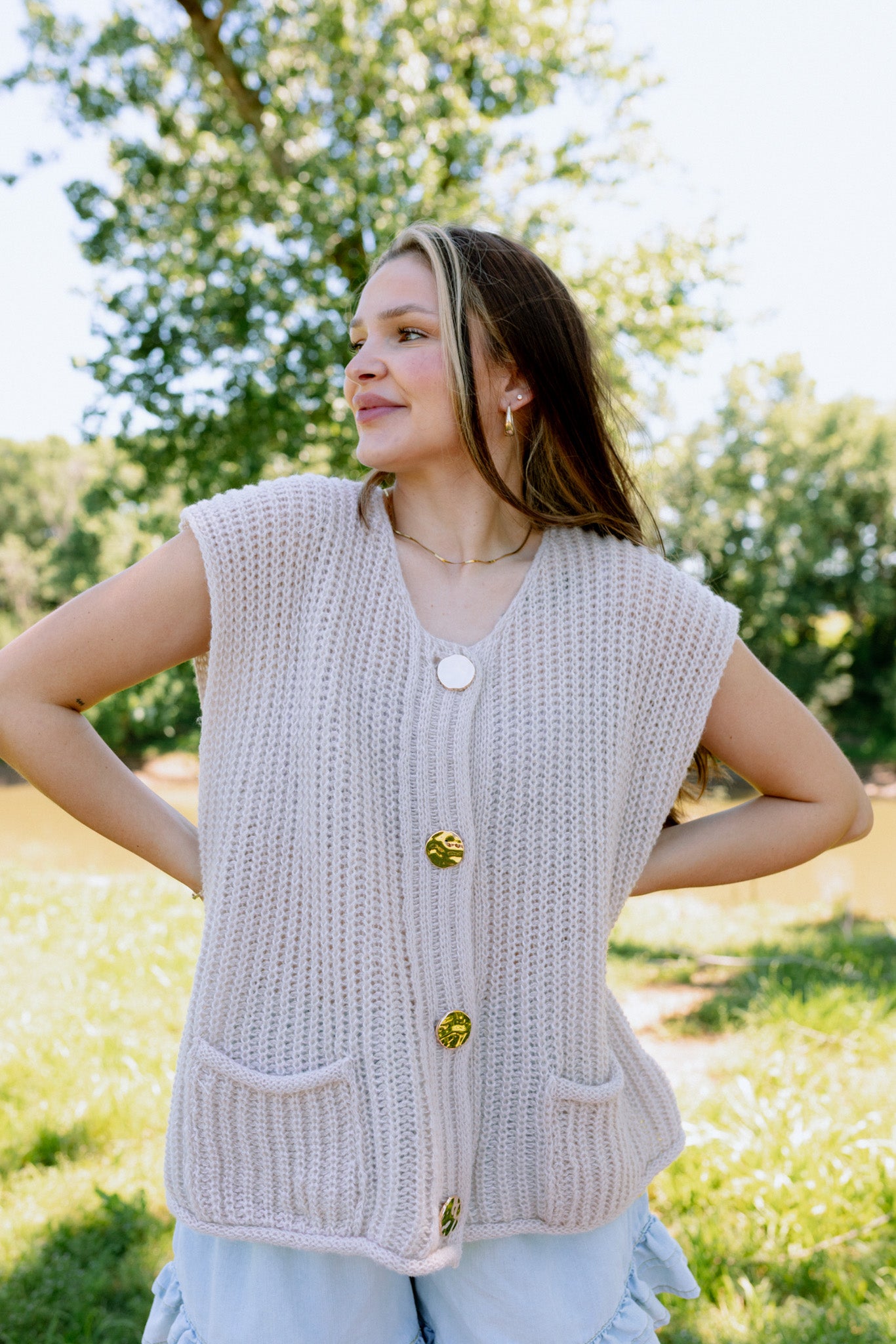 Heart Skipping button up sweater vest, shown in one of two available colors