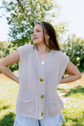 Heart Skipping button up sweater vest, shown in one of two available colors