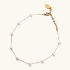 Camille pearl anklet with spaced white pearl accents, a fine gold-tone chain, lobster clasp and extender.