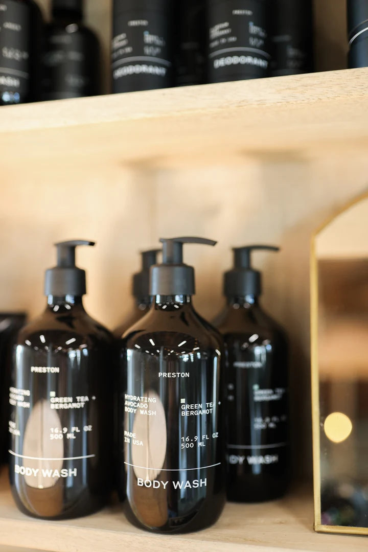Preston Green Tea and Bergamot Body Wash bottles lined up on a bathroom shelf