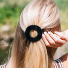 Teleties Jet Black Medium Flat Circle Hair Clip worn in blonde half-up hair