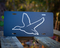 Decorative license plates in camo turkey, farm, and patriotic novelty designs