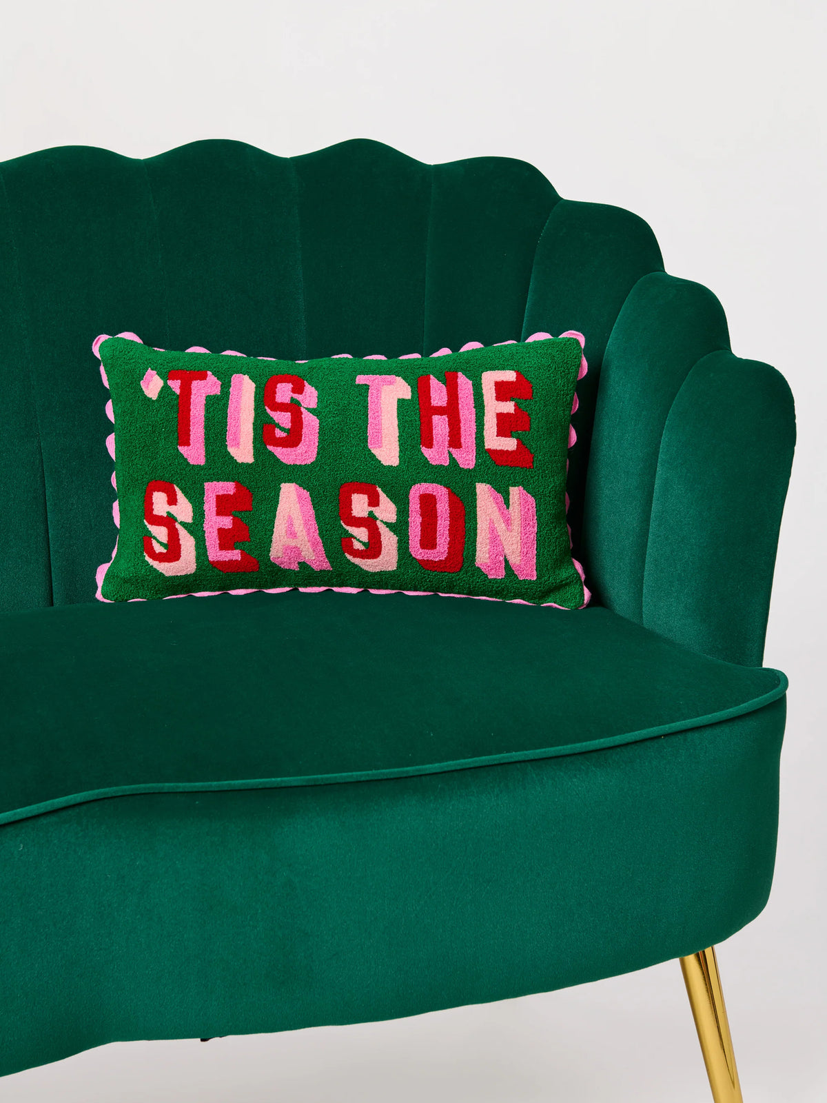 Shiraleah Tis The Season pillow shown on a green velvet scalloped chair