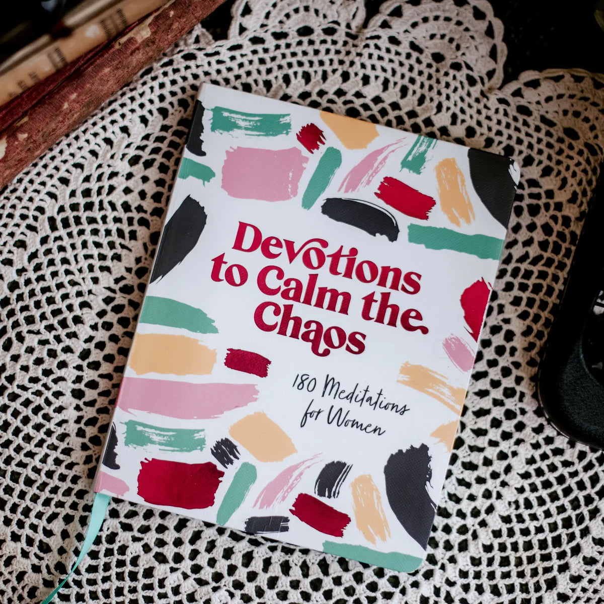 Devotions to Calm the Chaos for women, cover on a lace doily