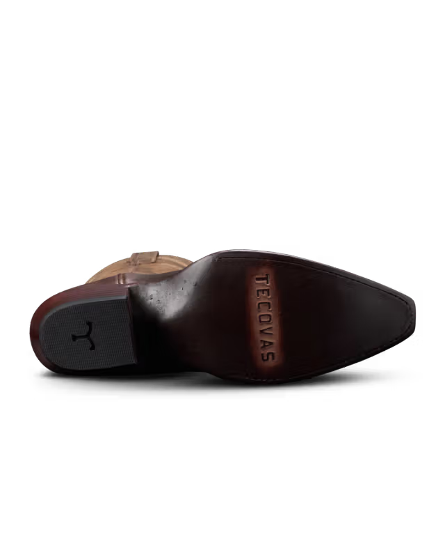 Brown shoe with 'Tecovas' branding on a white background
