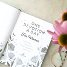 One Devotion a Day for Women, open to grey floral title page