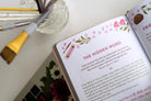 Digital Detox Devotions, open to The Hidden Word page with paintbrushes