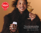 Model with a martini holding Touchland Spiced Pumpkin-Tini, Allure Best of Beauty badge